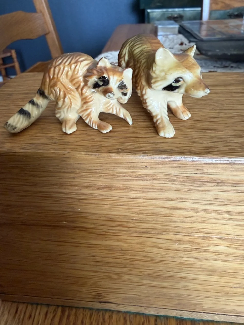 Mini pair of raccoon figurines